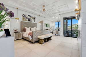 Bedroom featuring coffered ceiling, access to outside, and french doors