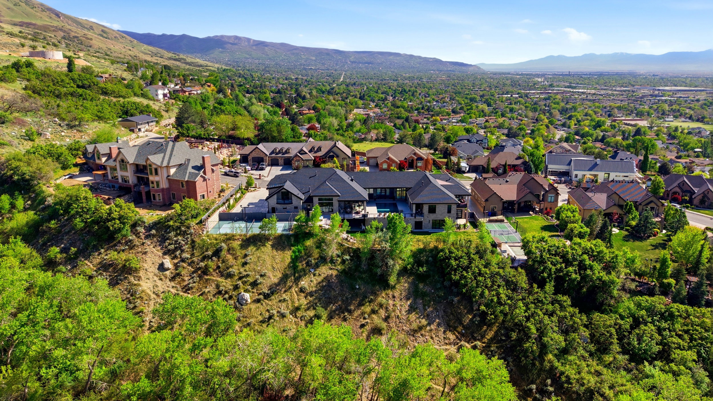 Aerial view of residential area with a mountainous background