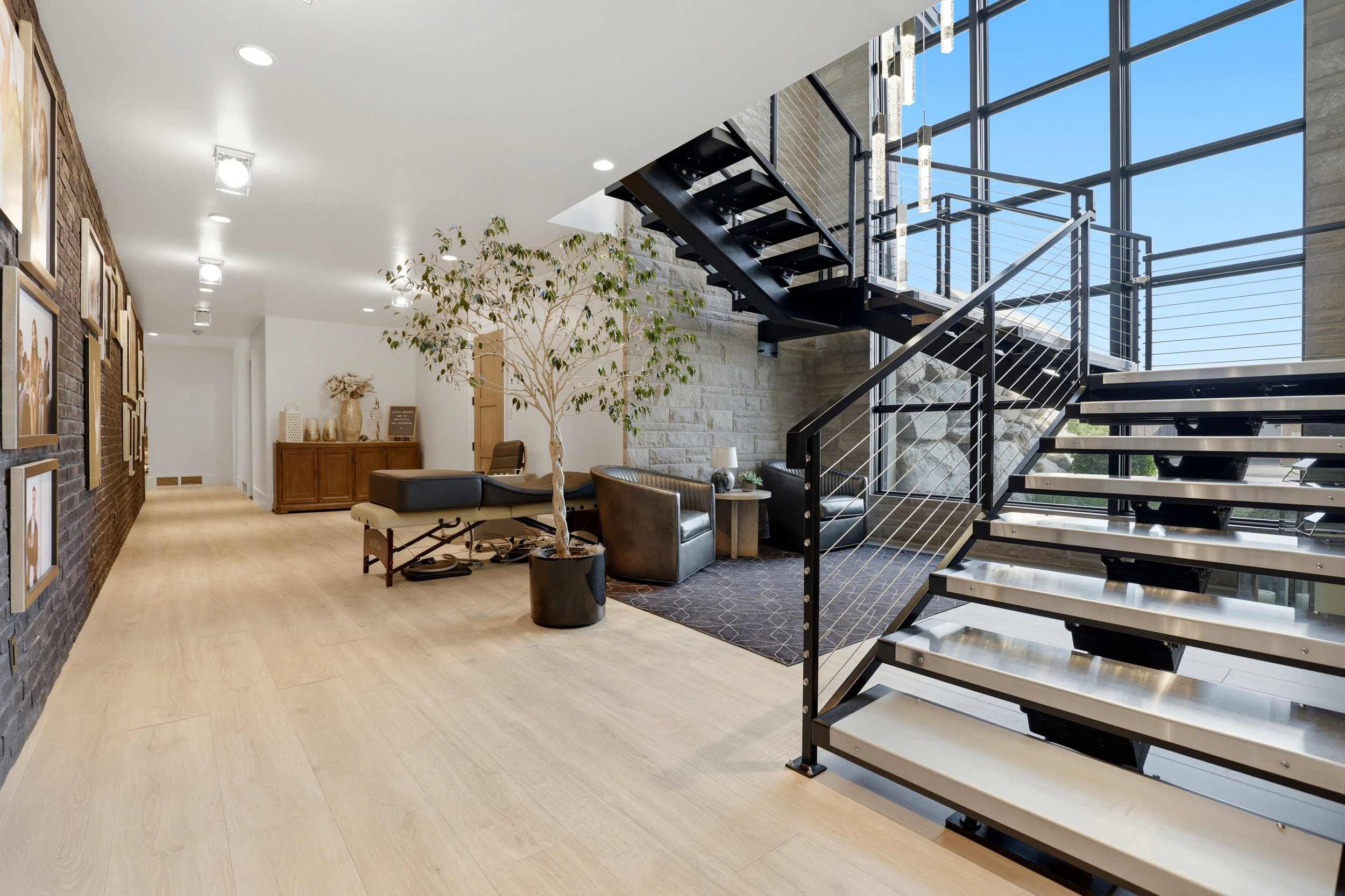 Staircase featuring wood finished floors and recessed lighting