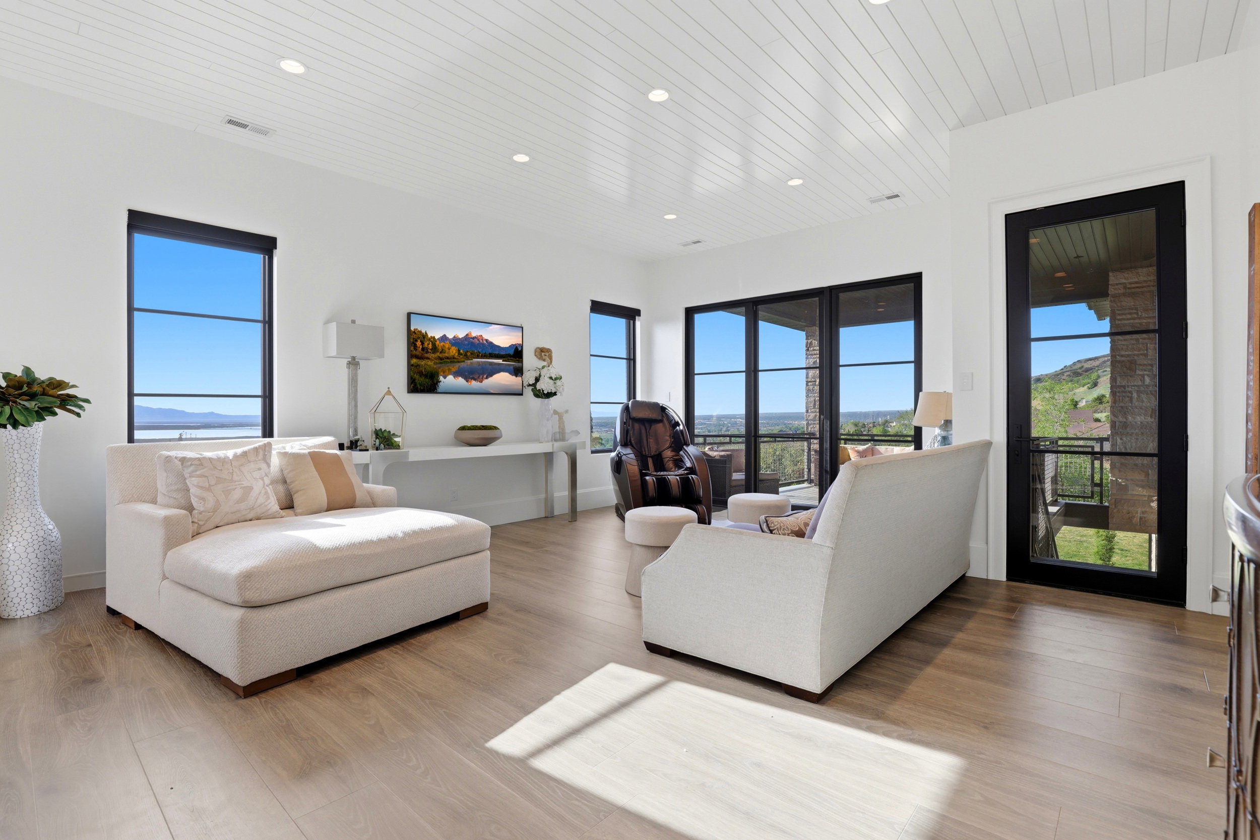 Living area featuring light wood-style flooring, wood ceiling, and recessed lighting