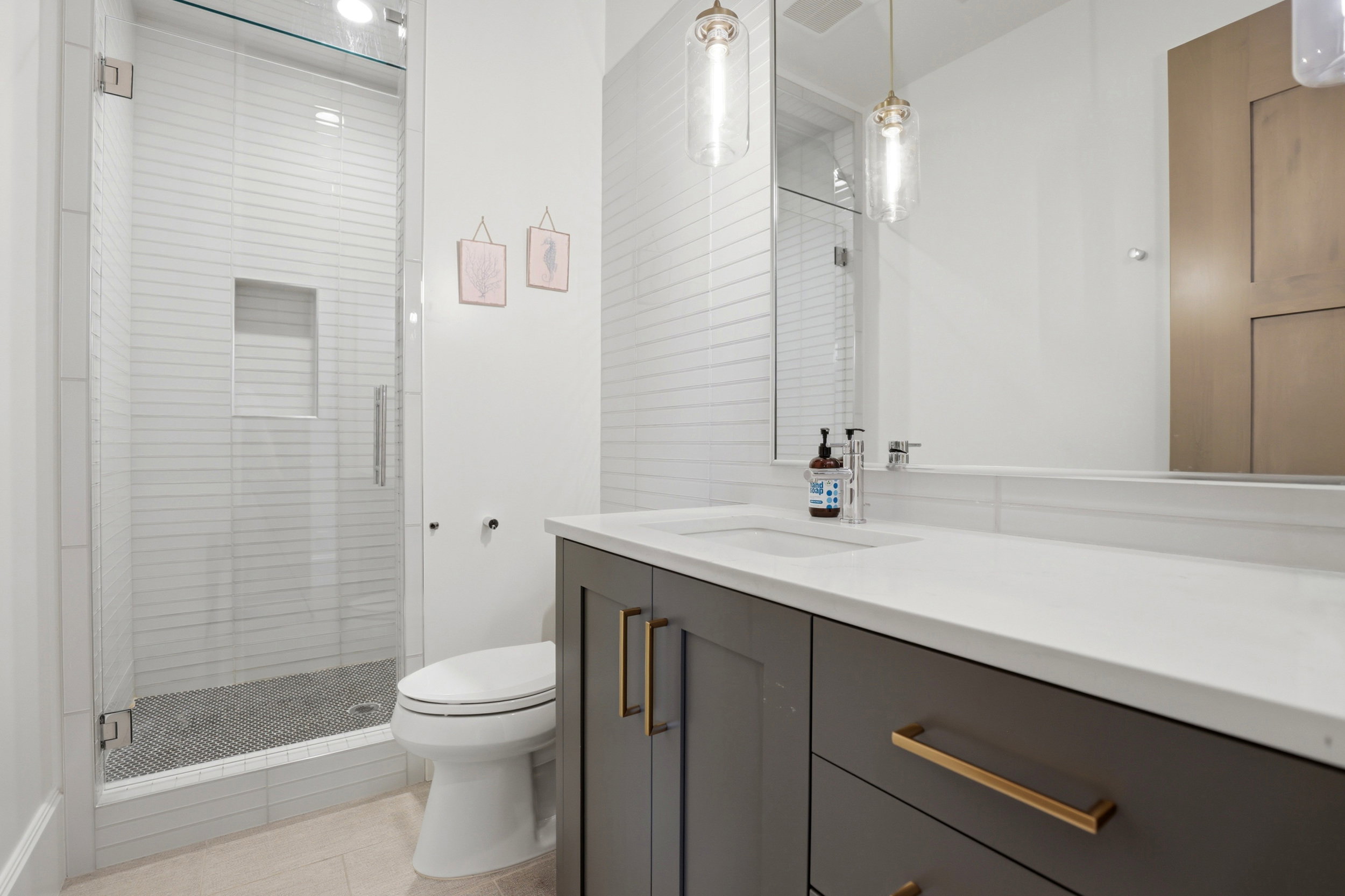 Full bathroom featuring vanity, a shower stall, and light tile patterned floors