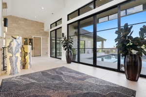 Common area featuring a high ceiling and recessed lighting