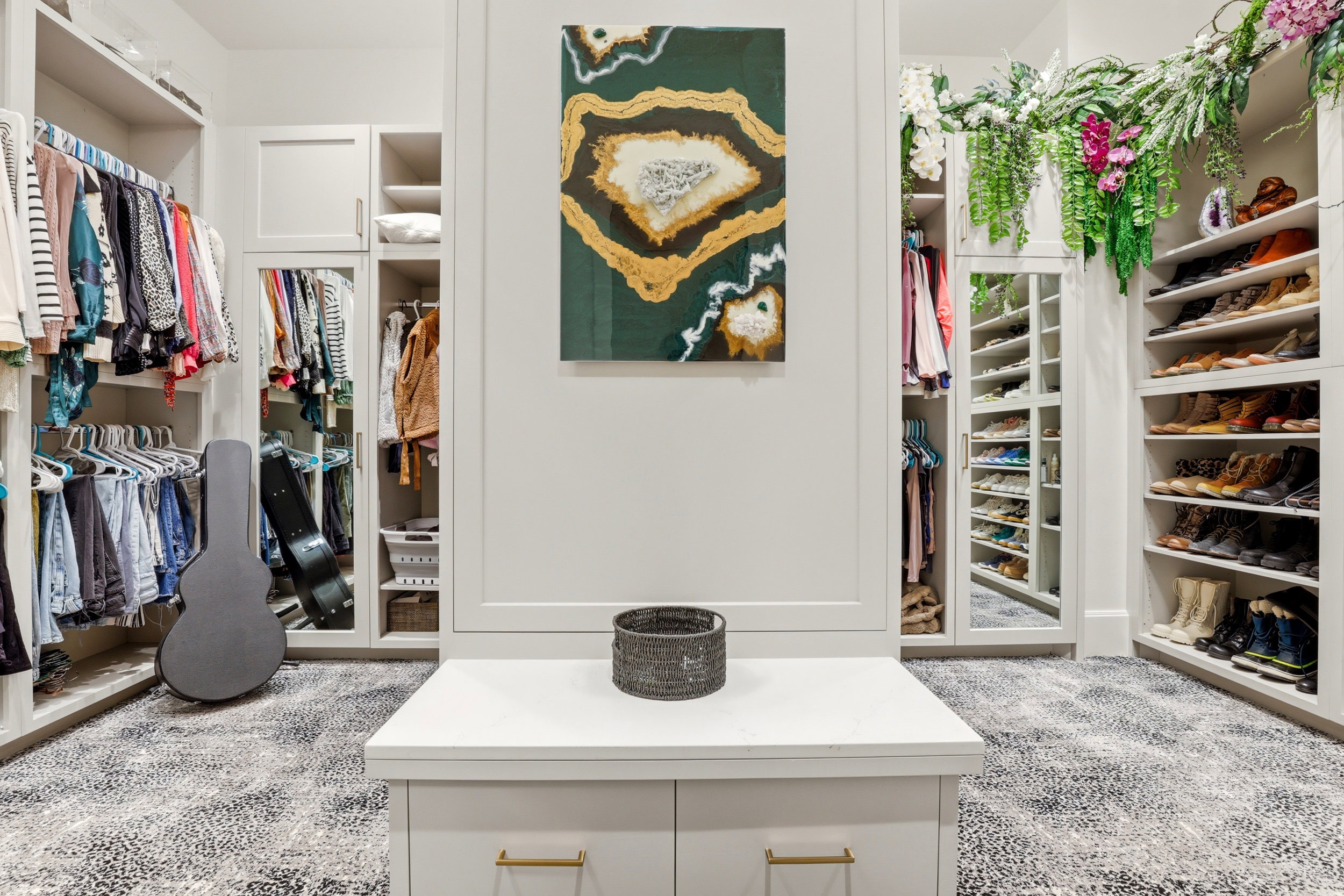 Walk in closet with light colored carpet