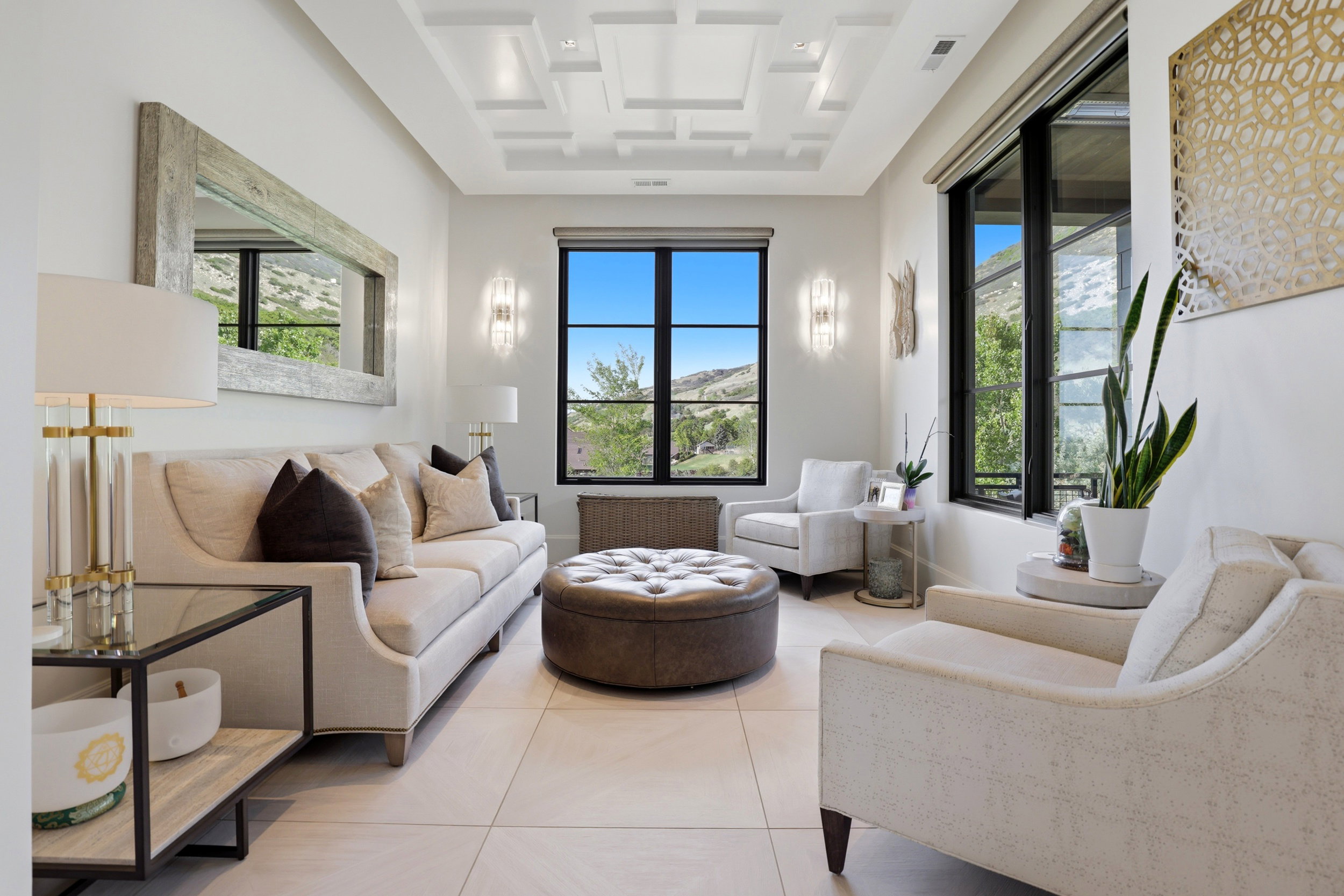 Sitting room with coffered ceiling and light tile patterned floors