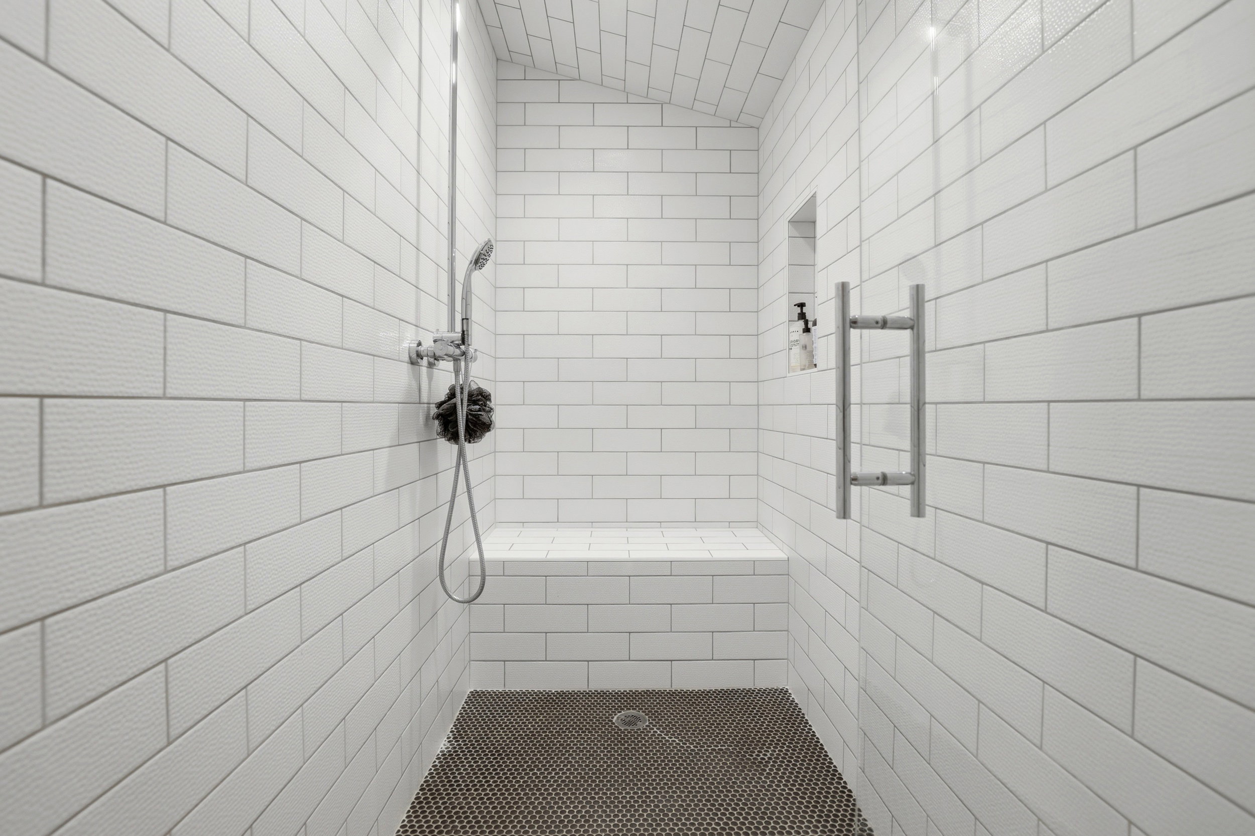 Full bath featuring a tile shower