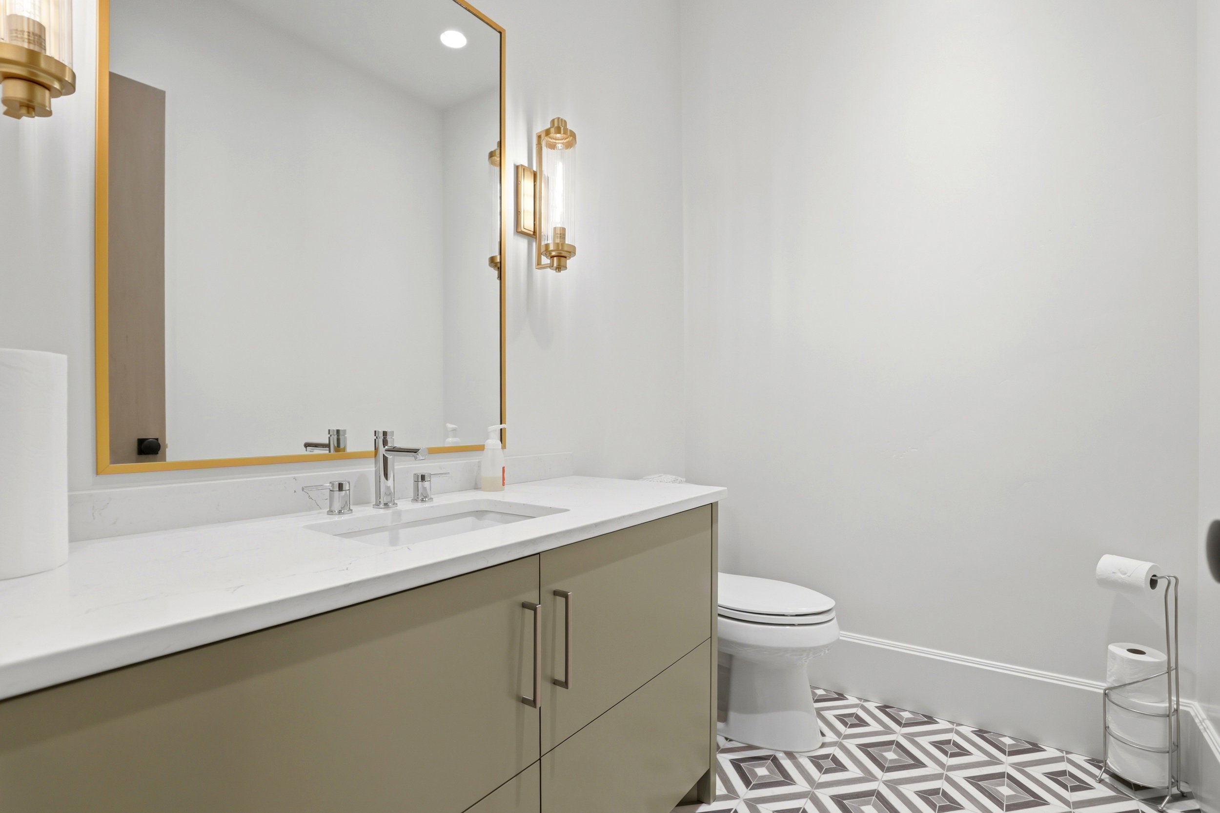 Bathroom with vanity and recessed lighting