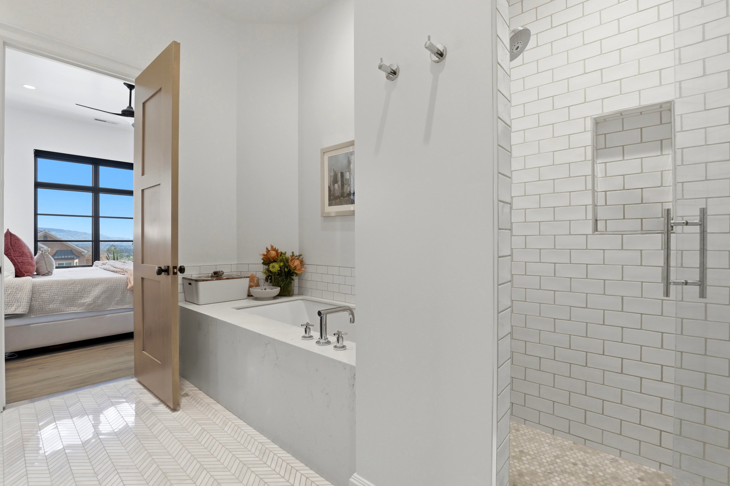 Bathroom with ensuite bath, a shower stall, light tile patterned floors, and a bath