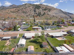 Aerial view of residential area featuring a mountainous background