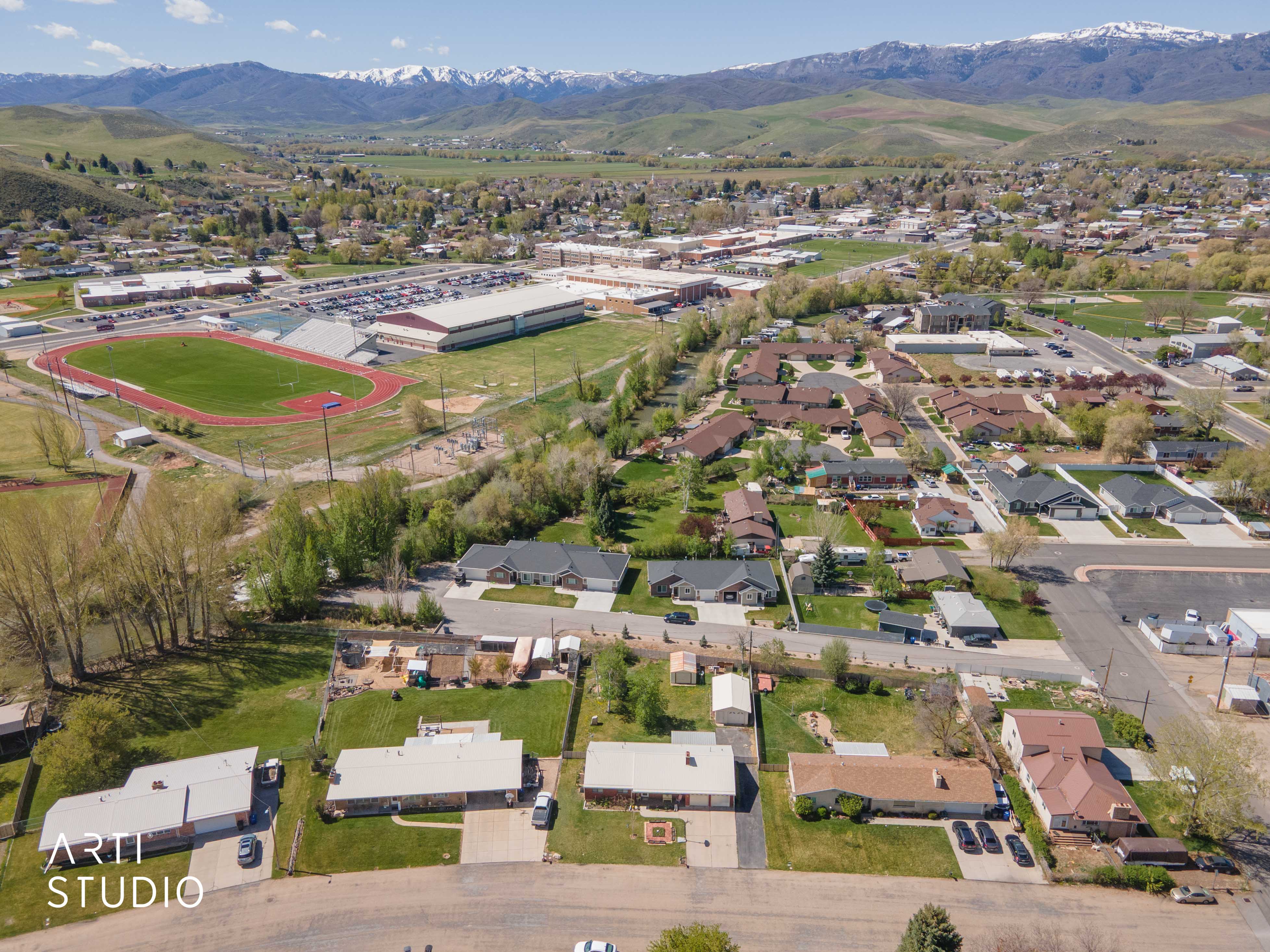 Aerial perspective of suburban area with a mountainous background