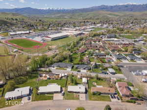 Aerial perspective of suburban area with a mountainous background