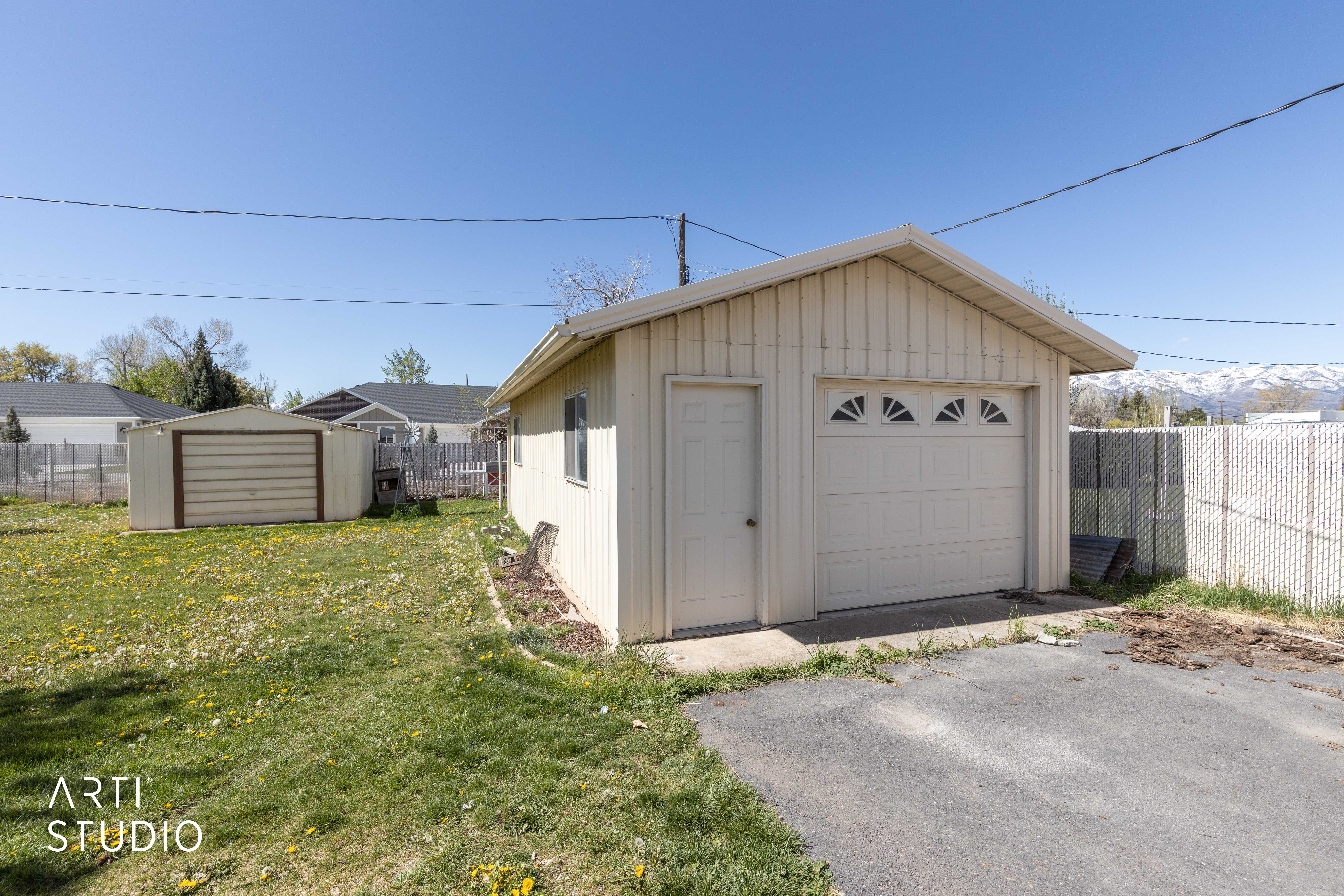 Detached garage featuring asphalt driveway 27 x 15 heated