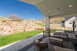 View of patio with an outdoor lounge area and a mountain view