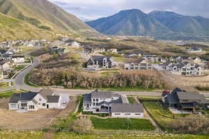 Aerial perspective of suburban area featuring a mountainous background
