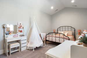 Bedroom featuring carpet and lofted ceiling