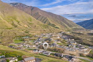 Aerial perspective of suburban area featuring a mountainous background