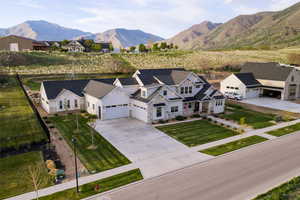 Aerial view of residential area featuring a mountain backdrop