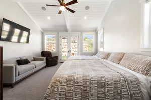 Carpeted bedroom with french doors, vaulted ceiling with beams, access to exterior, a ceiling fan, and wood ceiling