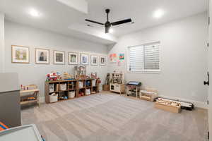 Playroom with a ceiling fan, light colored carpet, and recessed lighting
