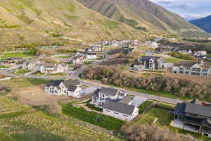 Aerial view of residential area featuring mountains
