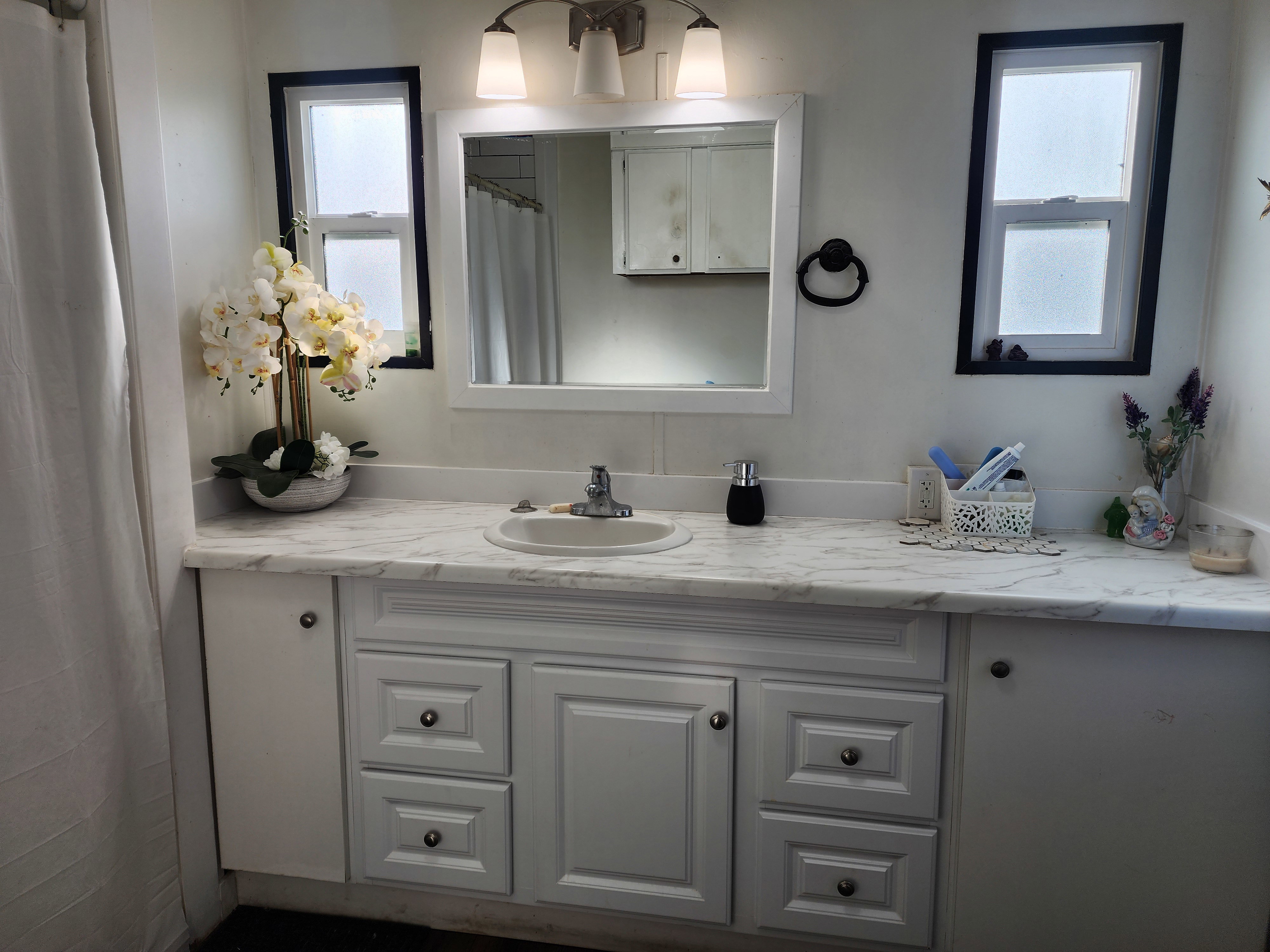 Bathroom with vanity and a shower with curtain