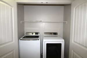 Laundry area featuring independent washer and dryer