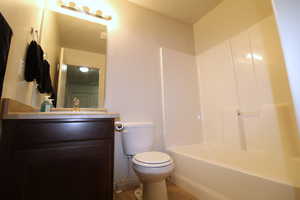 Main Bathroom featuring vanity, light tile patterned flooring, and shower / bath combination