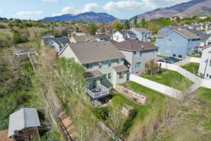 Aerial view of residential area featuring a mountainous background