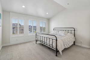 Master bedroom with vaulted ceiings