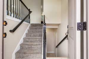 Staircase with tile patterned floors