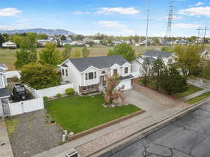 View of front facade with concrete driveway, a garage, and a residential view