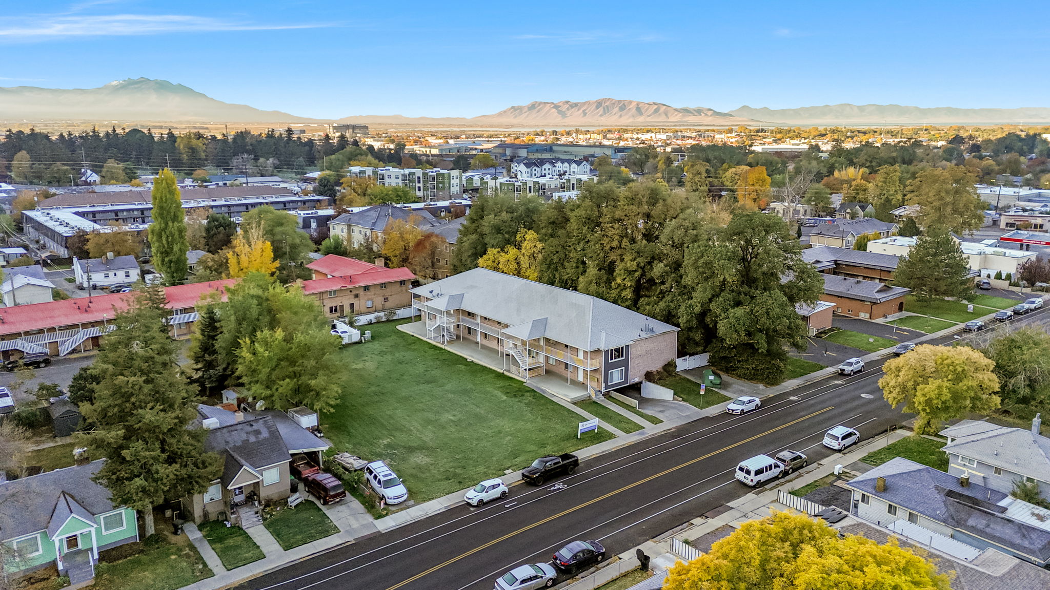 Aerial perspective of suburban area with a mountain backdrop