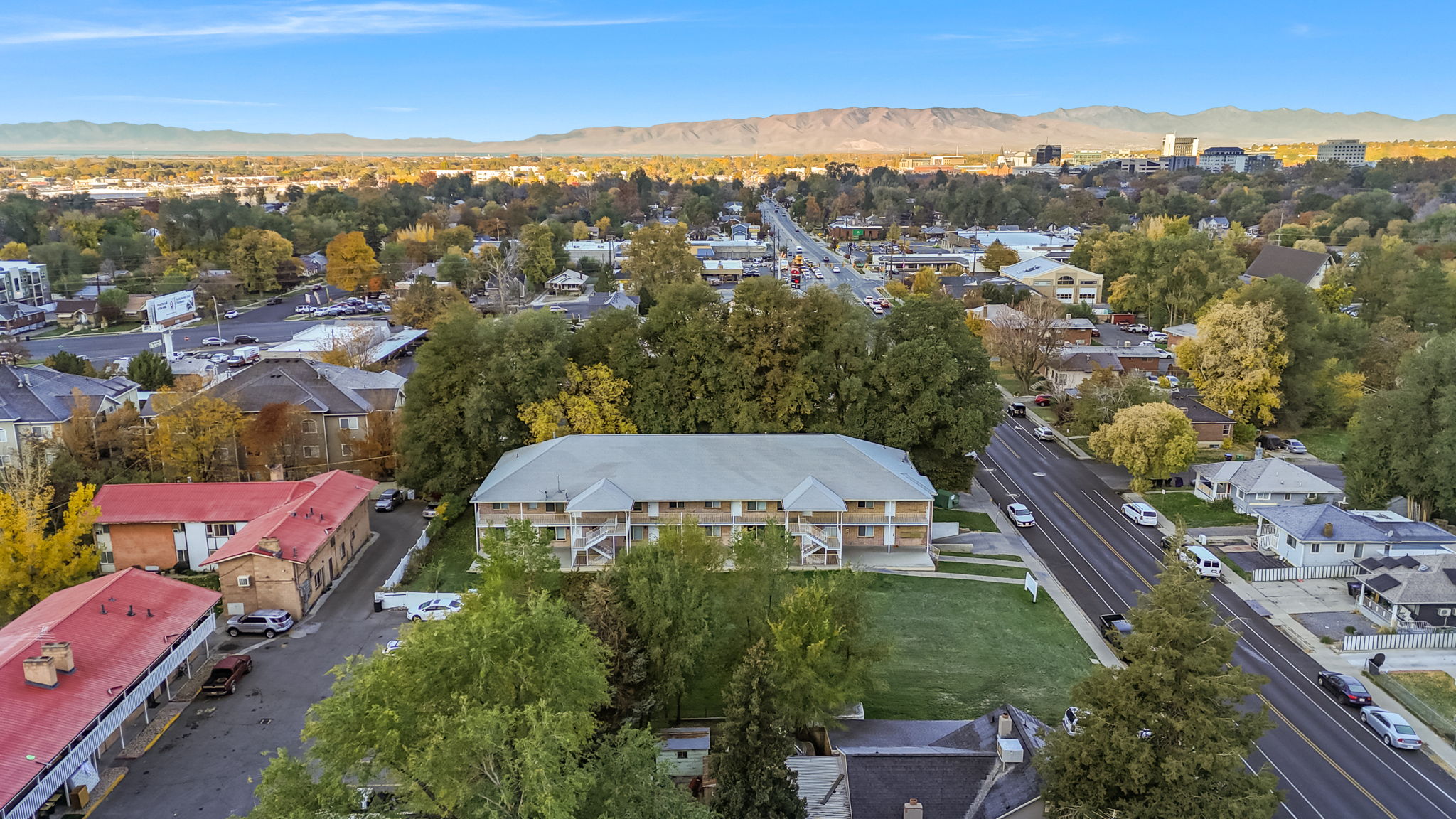 Aerial perspective of suburban area with a mountain backdrop