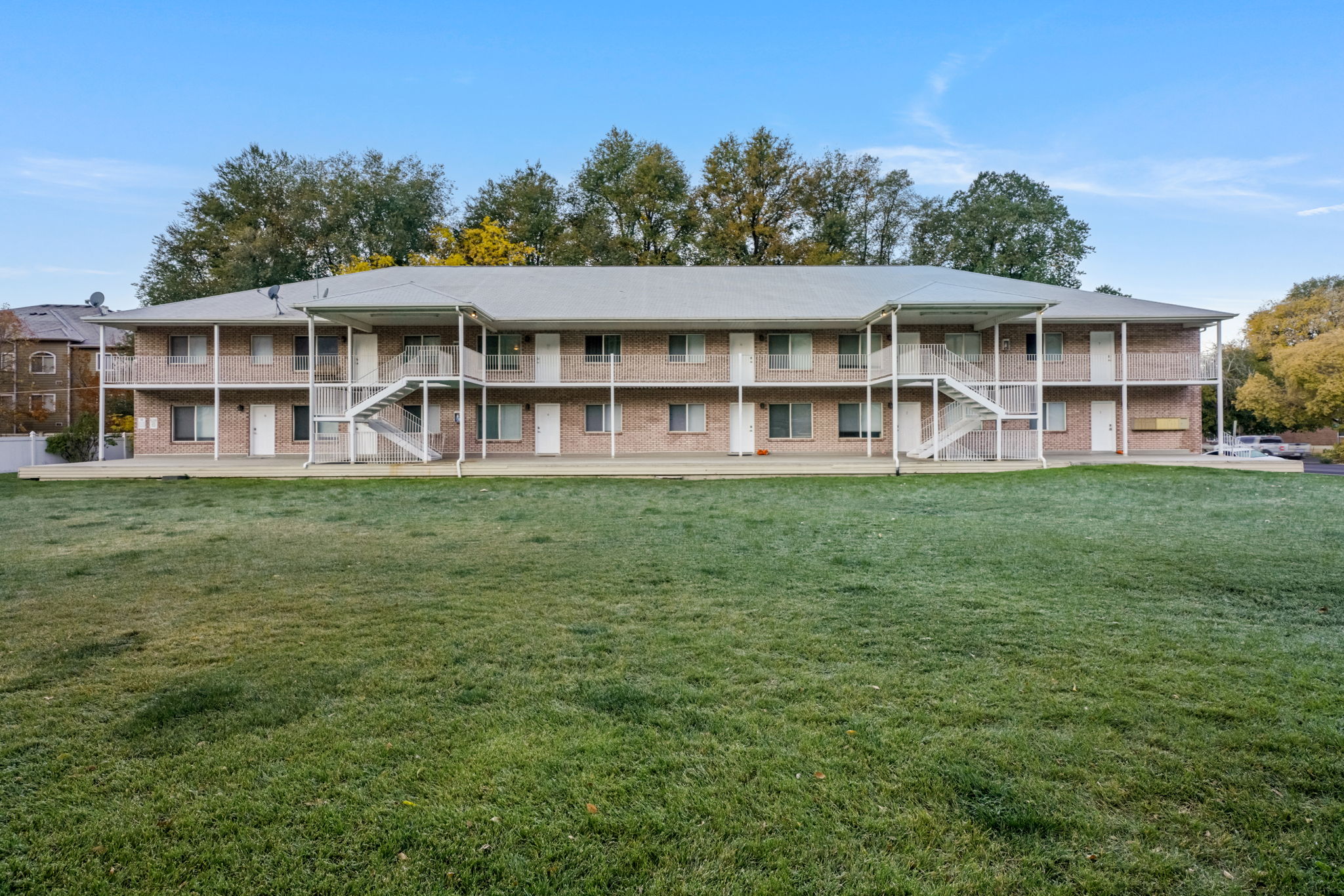 View of apartment building / complex with stairs