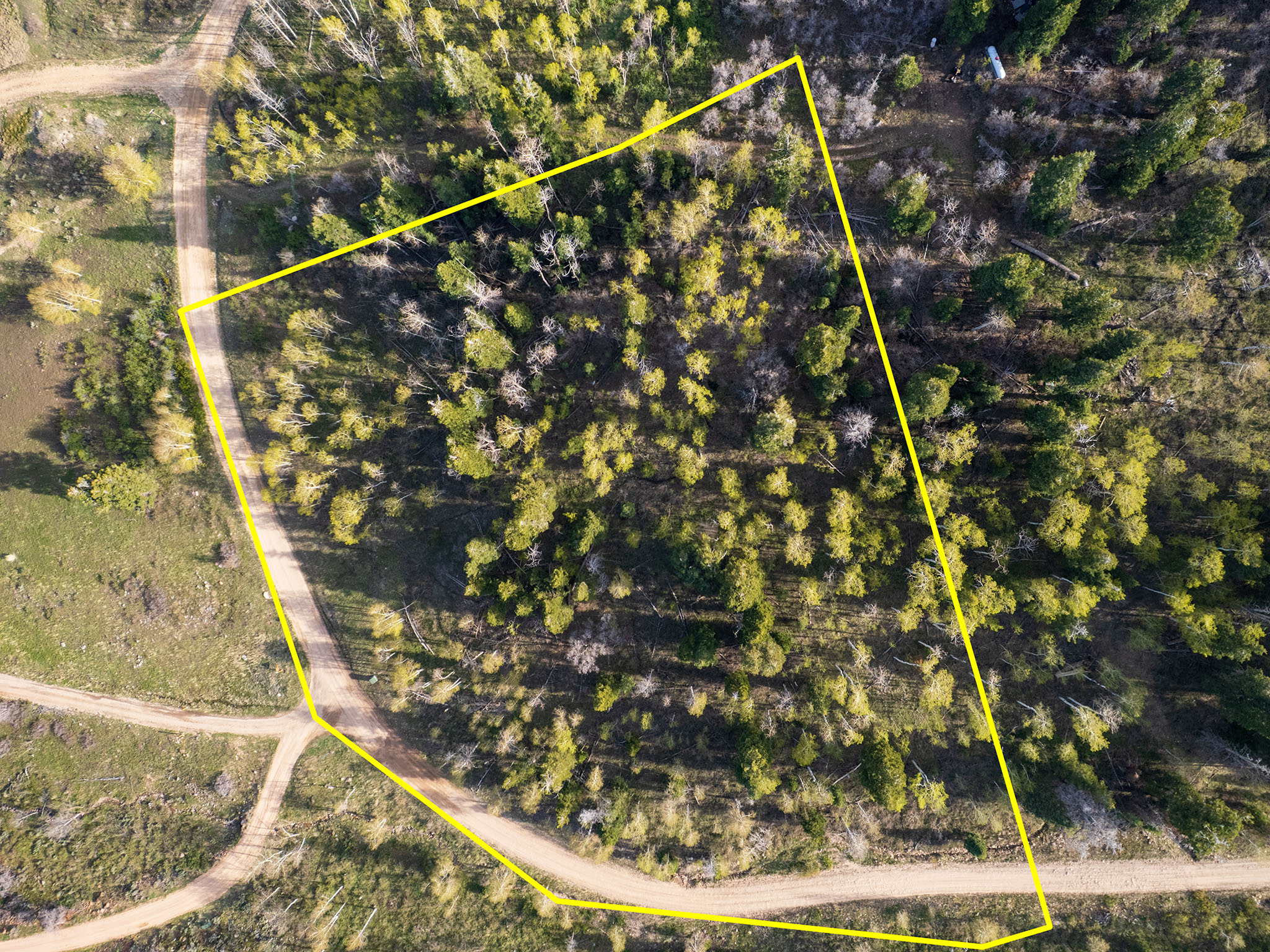 Aerial overview of property's location with property parcel outlined