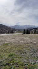View of mountain background featuring rural landscape