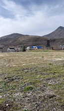 View of mountain background featuring rural landscape