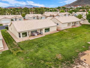 Aerial perspective of suburban area with a mountain backdrop