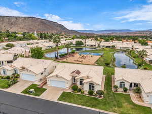 Aerial view of residential area featuring a water and mountain view