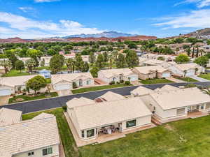 Aerial view of residential area featuring a mountain backdrop