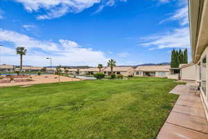 View of grassy yard with a residential view