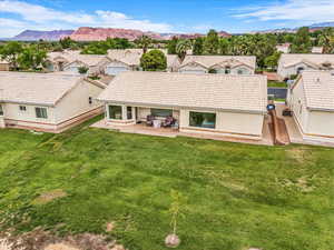 Aerial perspective of suburban area featuring a mountainous background