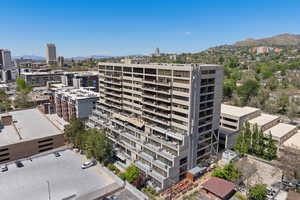 View of property featuring a mountain view and a city view