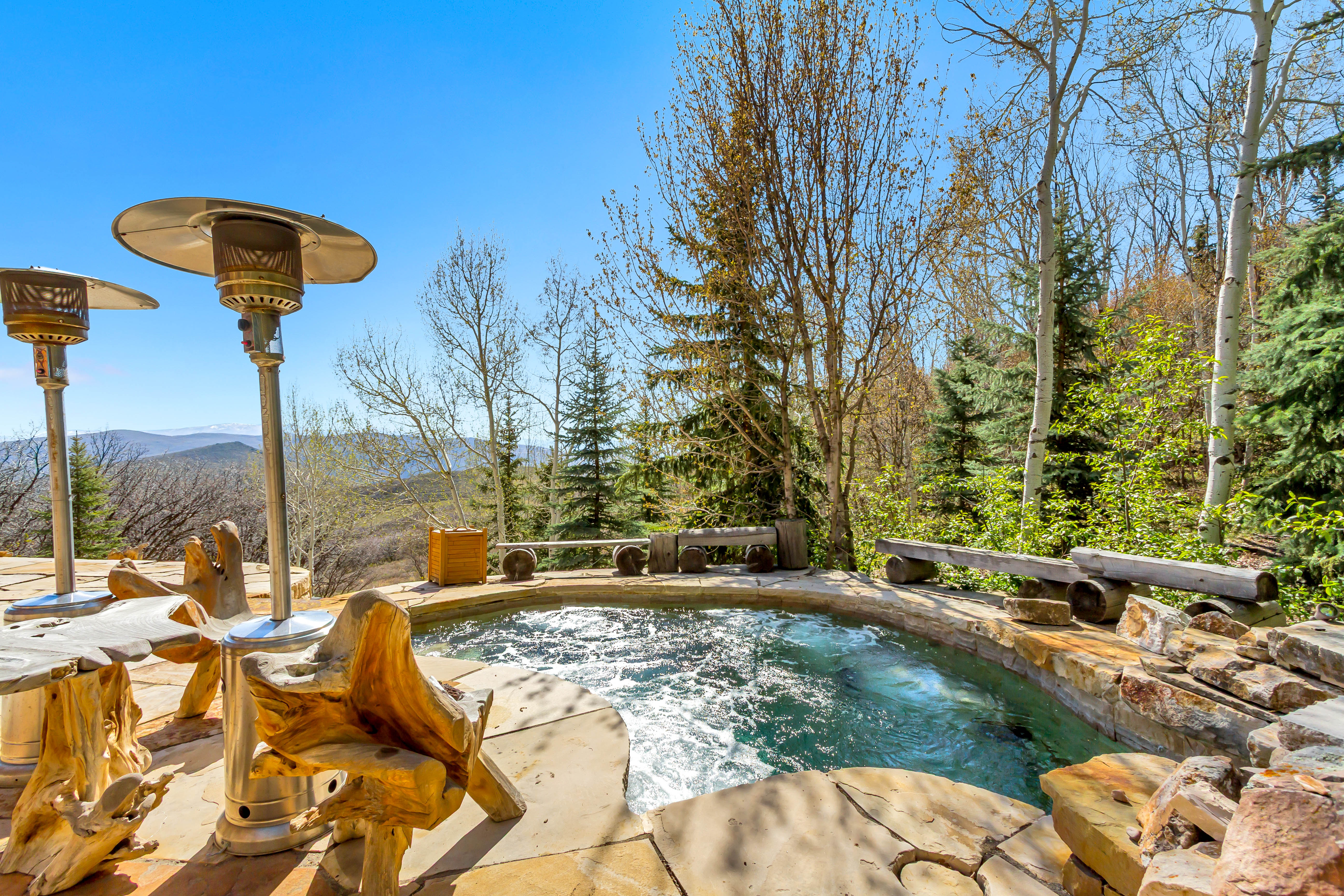 View of pool featuring a swimming pool, a mountain view, and patio surround
