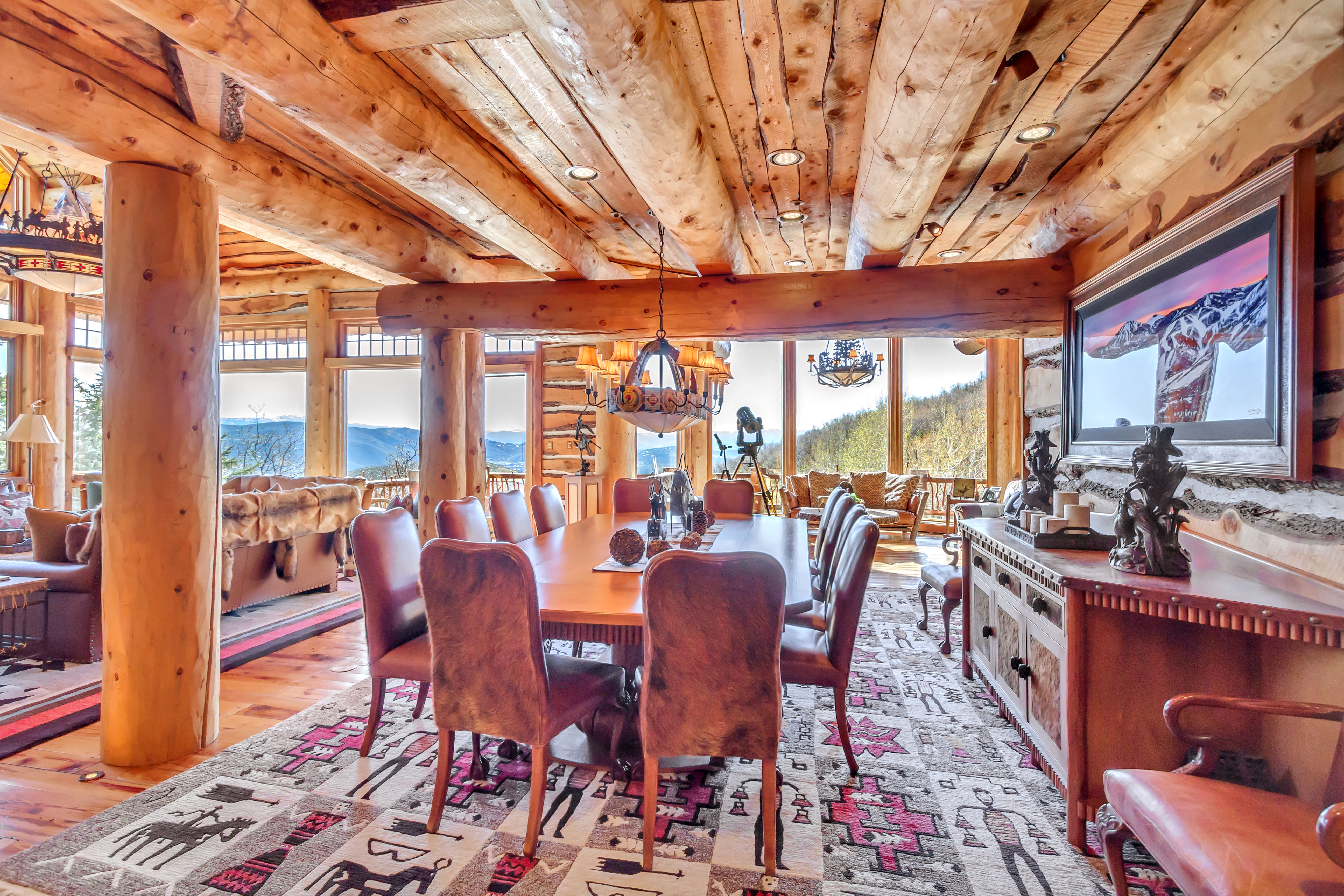 Dining room featuring light wood-style flooring, recessed lighting, log walls, and wooden ceiling