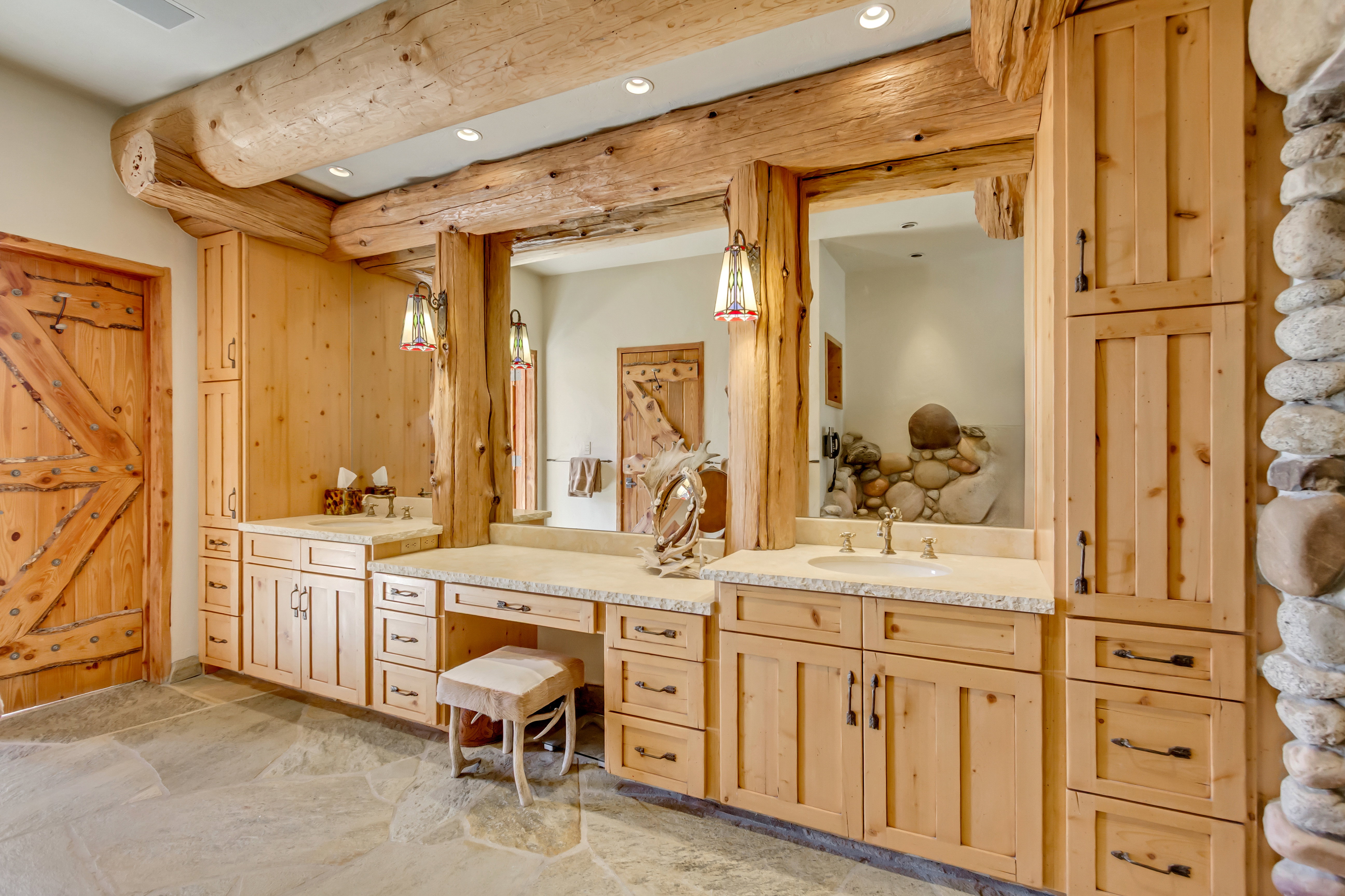 Full bath with vanity, recessed lighting, and light stone finish floors