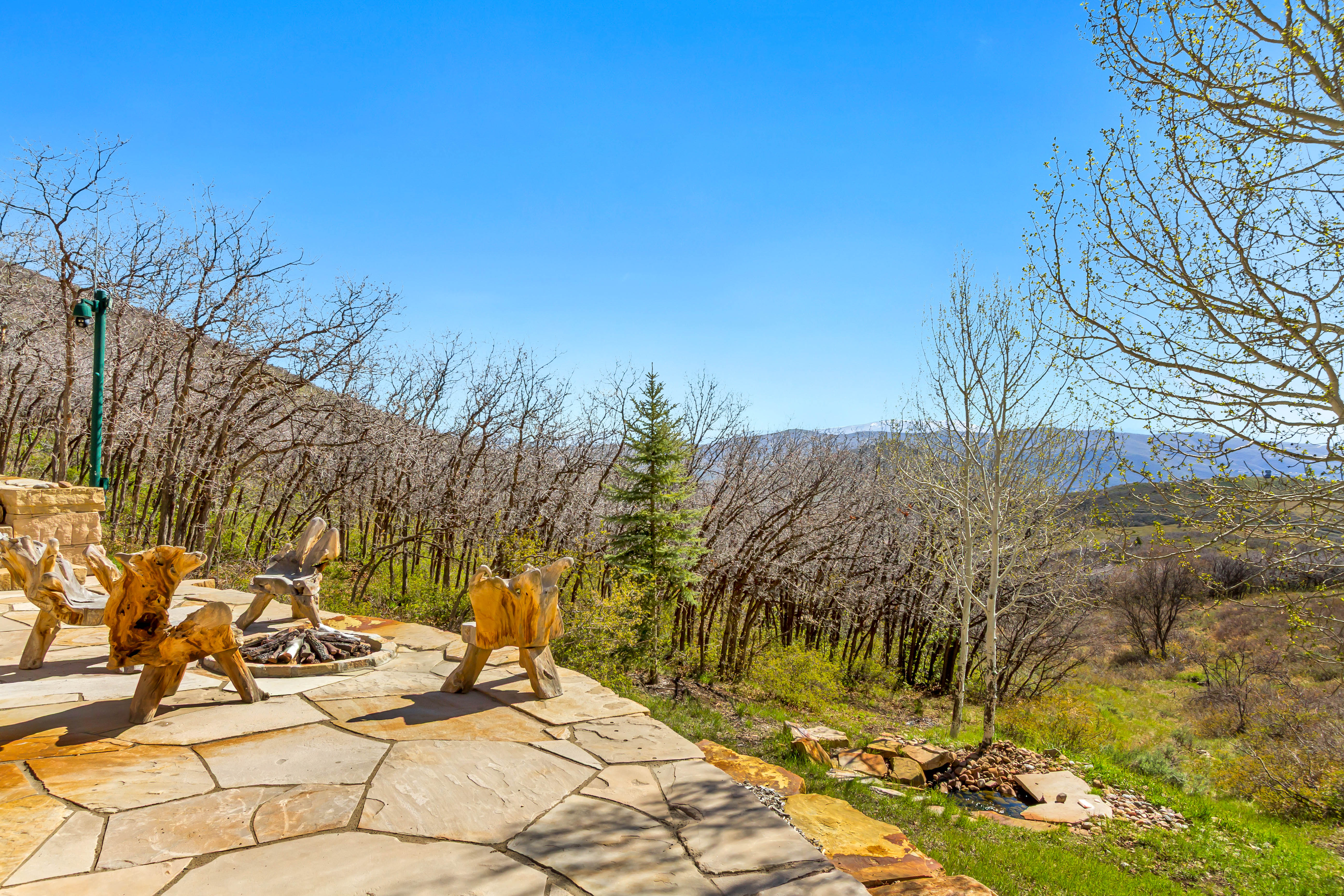View of patio with a fire pit and a mountain view