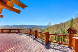 Wooden terrace featuring a mountain view