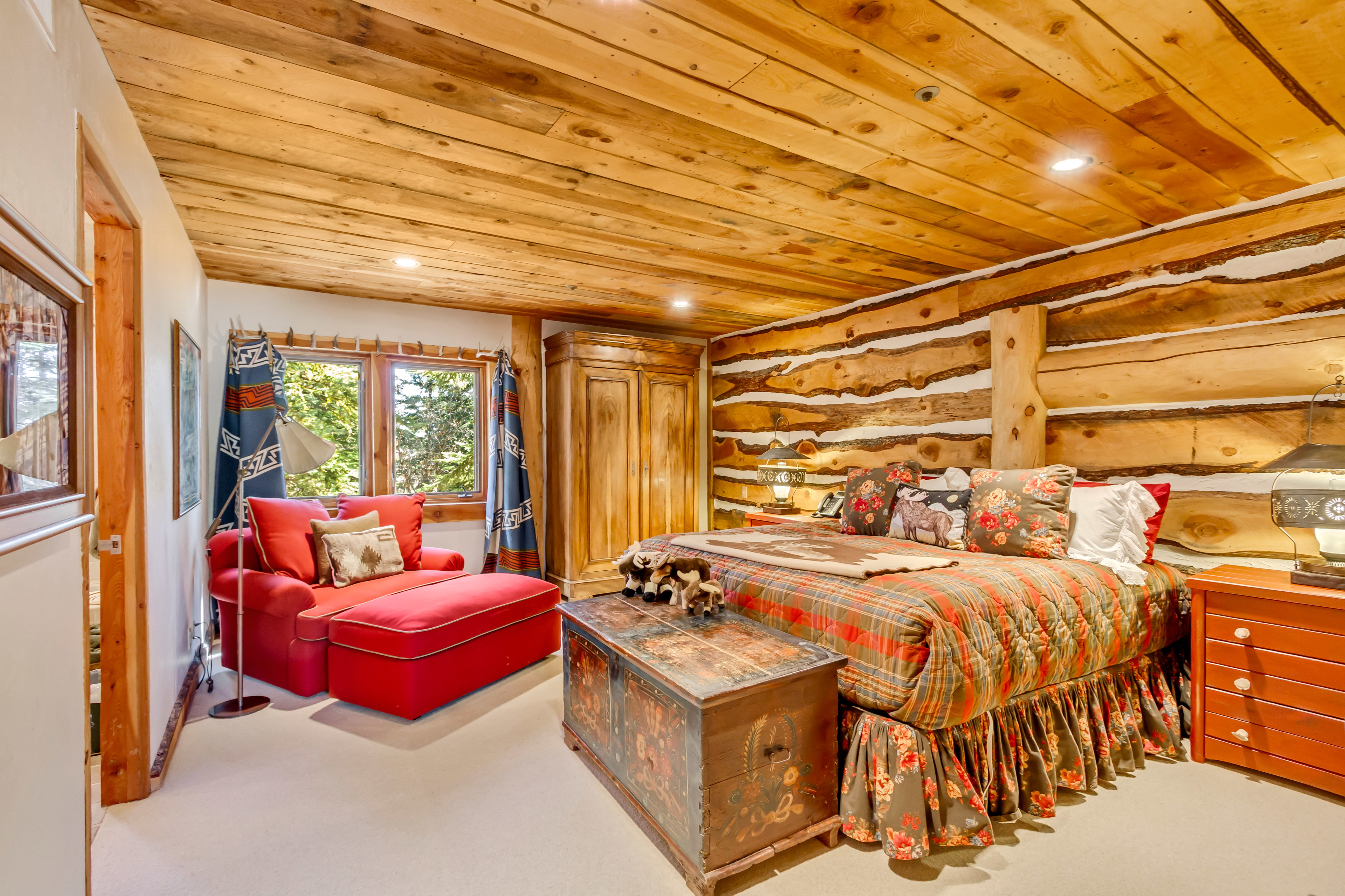Bedroom with wooden ceiling, light carpet, recessed lighting, and log walls