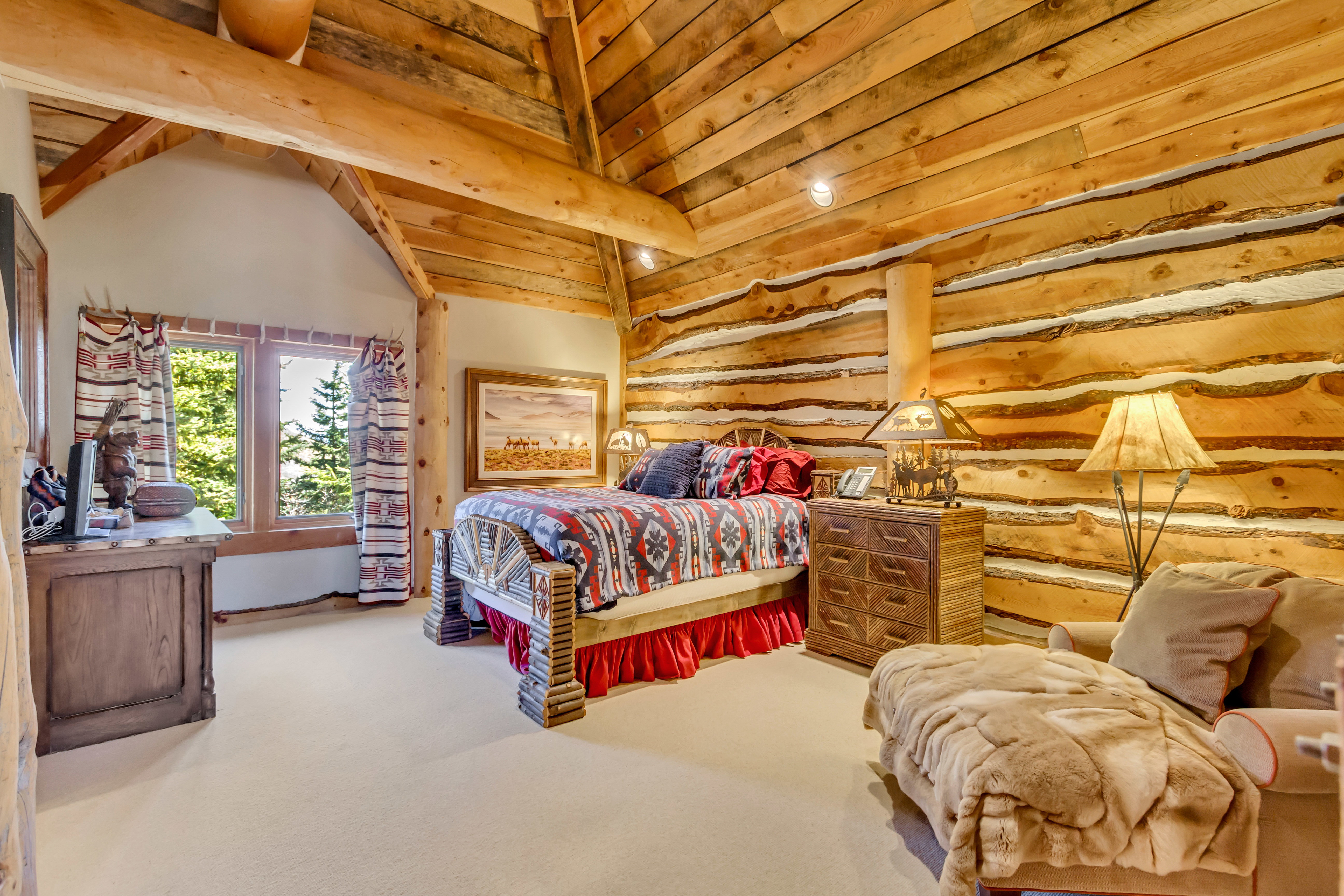Bedroom with carpet flooring and lofted ceiling with beams