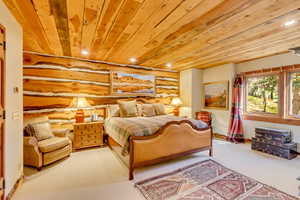 Carpeted bedroom featuring recessed lighting and wood ceiling